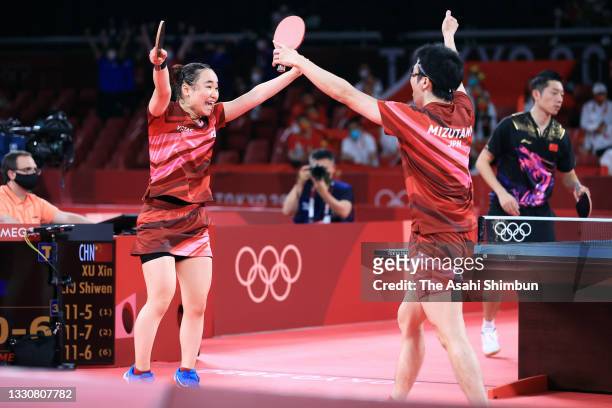 Mima Ito and Jun Mizutani of Team Japan celebrate winning the gold medal after beating Liu Shiwen and Xu Xin of Team China in the Mixed Doubles final...