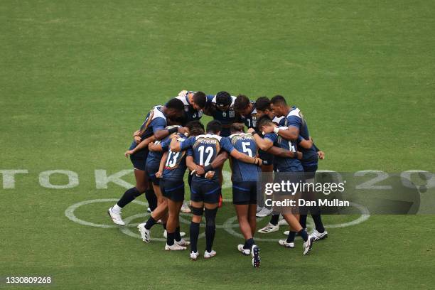The Team Japan huddle during the Men's Pool B Rugby Sevens match between Canada and Japan on day four of the Tokyo 2020 Olympic Games at Tokyo...