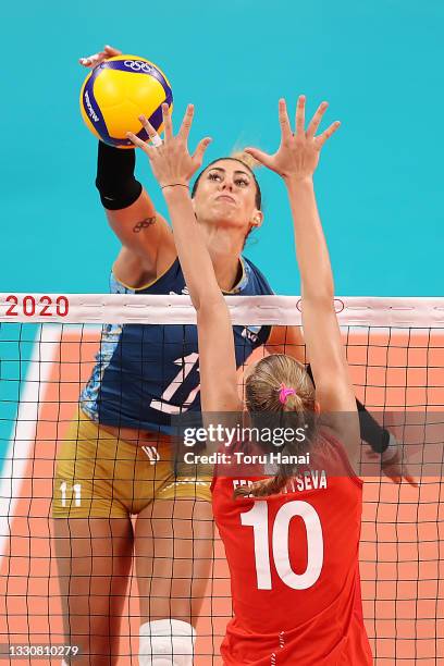 Arina Fedorovtseva of Team ROC defends against the hit by Julieta Constanza Lazcano of Team Argentina during the Women's Preliminary - Pool B...