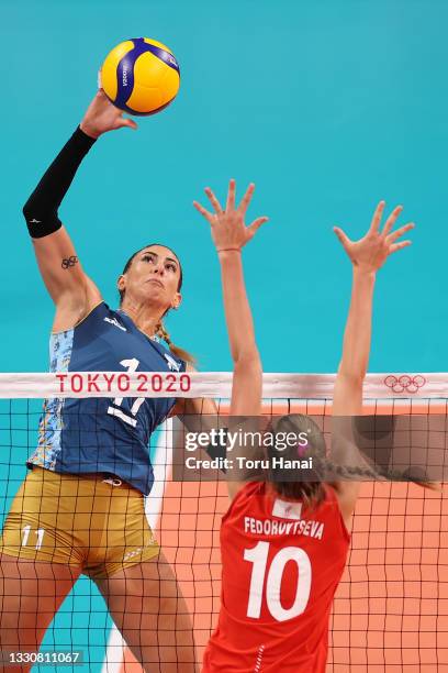 Julieta Constanza Lazcano of Team Argentina hits over Arina Fedorovtseva of Team ROC during the Women's Preliminary - Pool B volleyball on day four...