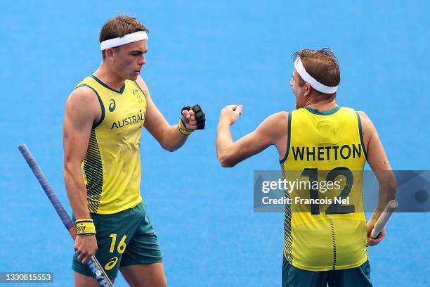 Tim Howard and Jacob Thomas Whetton of Team Australia fist bump during the Men's Preliminary Pool A match between Australia and Argentina on day four...