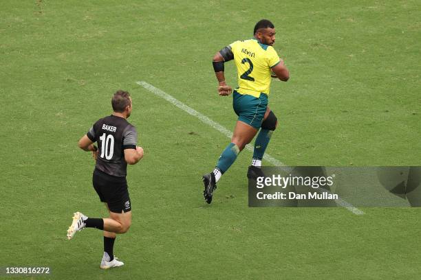 Samu Kerevi of Team Australia breaks past Kurt Baker of Team New Zealand to score a try during the Men's Pool A Rugby Sevens match between New...