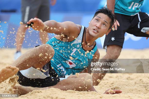 Yusuke Ishijima of Team Japan looks on against Team Italy during the Men's Preliminary - Pool F beach volleyball on day four of the Tokyo 2020...