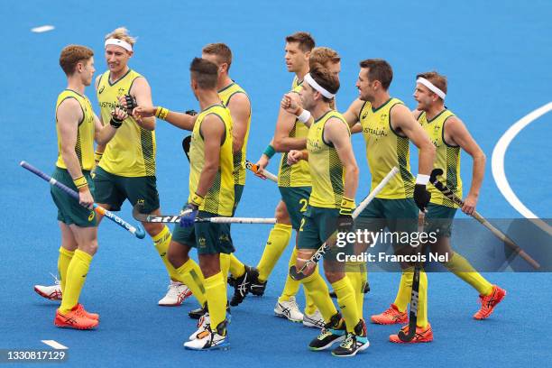 Jeremy Thomas Hayward of Team Australia celebrates scoring their fifth goal with teammates during the Men's Preliminary Pool A match between...