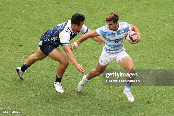 Rodrigo Etchart of Team Argentina takes on Seongmin Jang of Team South Korea during the Men's Pool A Rugby Sevens match between Argentina and South...