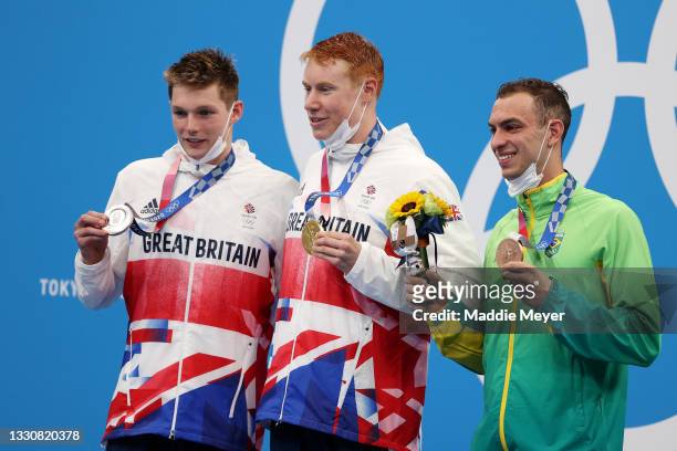 Silver medalist Duncan Scott of Team Great Britain, gold medalist Tom Dean of Team Great Britain and bronze medalist Fernando Scheffer of Team Brazil...