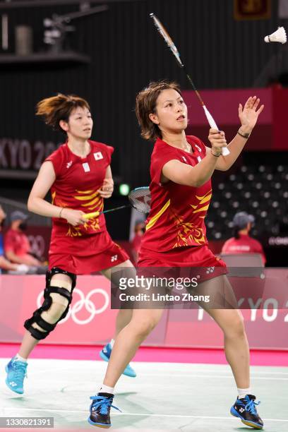 Yuki Fukushima and Sayaka Hirota of Team Japan compete against Greysia Polii and Apriyani Rahayu of Team Indonesia during a Women's Doubles Group A...