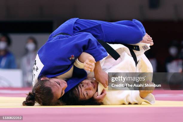 Tsukasa Yoshida of Team Japan and Nora Gjakova of Team Kosovo compete in the Women's -57kg semi final on day three of the Tokyo 2020 Olympic Games at...
