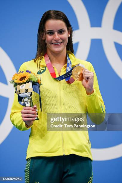 Kaylee McKeown of Team Australia poses with the gold medal after winning the Women's 100m Backstroke Final on day four of the Tokyo 2020 Olympic...