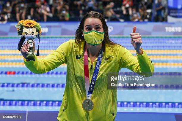 Kaylee McKeown of Team Australia poses with the gold medal for the Women's 100m Backstroke Final on day four of the Tokyo 2020 Olympic Games at Tokyo...