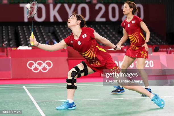 Yuki Fukushima and Sayaka Hirota of Team Japan compete against Greysia Polii and Apriyani Rahayu of Team Indonesia during a Women's Doubles Group A...