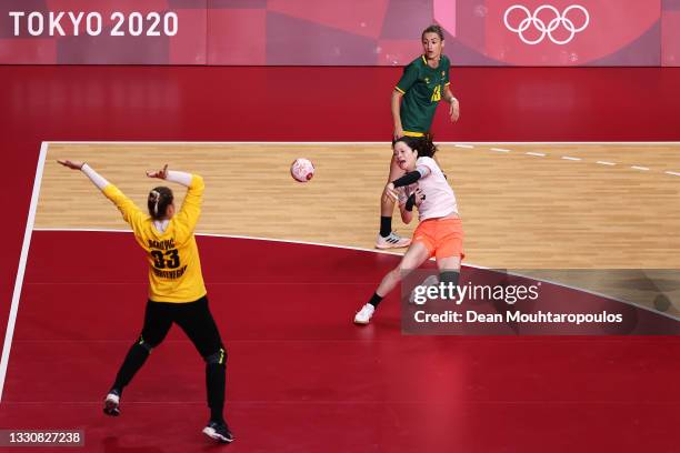 Yui Sunami of Team Japan shoots for goal at Anastasija Babovic of Team Montenegro as Dijana Mugosa of Team Montenegro looks on the Woman's...