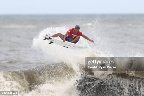 Kanoa Igarashi of Team Japan completes a huge aerial to find a last minute winning score against Gabriel Medina of Team Brazil during the men's semi...