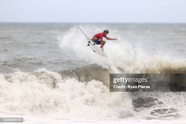 Kanoa Igarashi of Team Japan completes a huge aerial to find a last minute winning score against Gabriel Medina of Team Brazil during the men's semi...