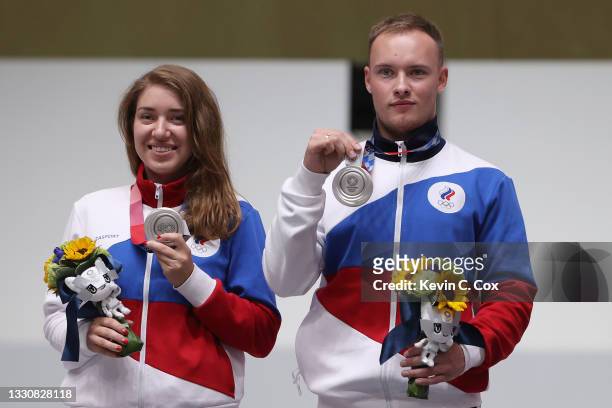 Silver Medalists Vitalina Batsarashkina and Artem Chernousov of Team ROC pose during the medal ceremony following the 10m Air Pistol Mixed Team event...