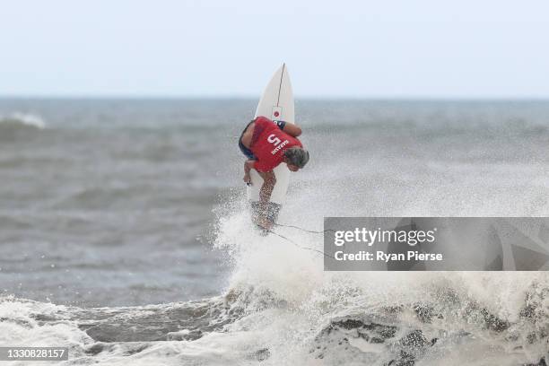 Kanoa Igarashi of Team Japan completes a huge aerial to find a last minute winning score against Gabriel Medina of Team Brazil during the men's semi...