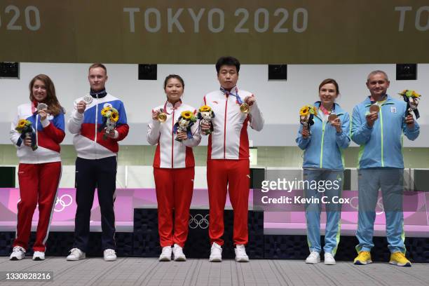 Silver Medalists Vitalina Batsarashkina and Artem Chernousov of Team ROC, Gold Medalists Ranxin Jiang and Wei Pang of Team China, and Bronze...
