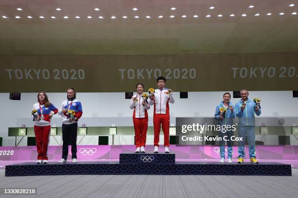 Silver Medalists Vitalina Batsarashkina and Artem Chernousov of Team ROC, Gold Medalists Ranxin Jiang and Wei Pang of Team China, and Bronze...