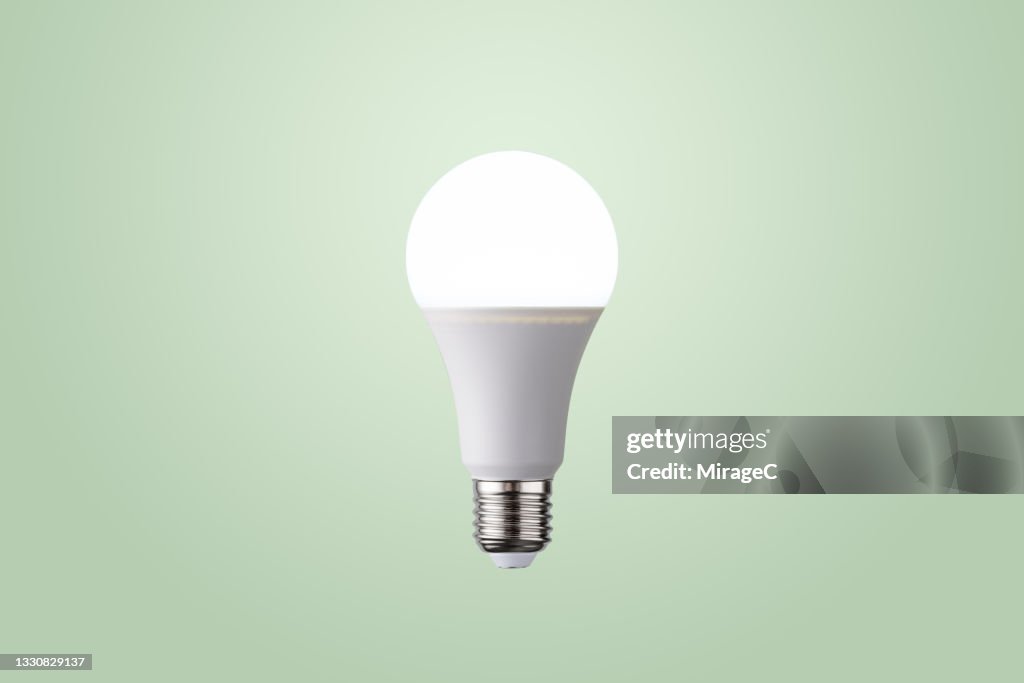 Illuminated LED Light Bulb Glowing in Mid Air