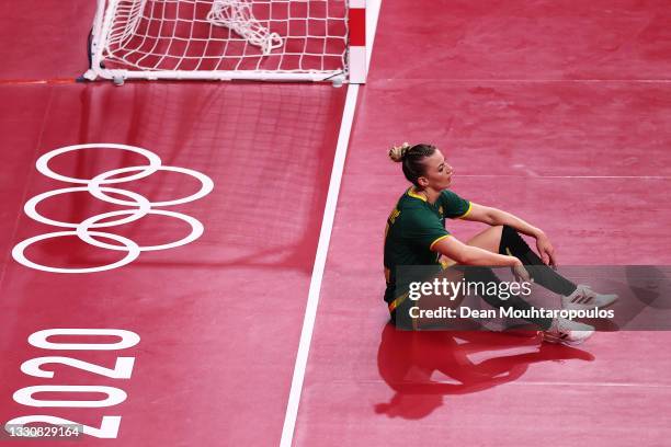 Jelena Despotovic of Team Montenegro looks dejected after giving away a penalty during the Woman's Preliminary Round Group A match between Japan and...