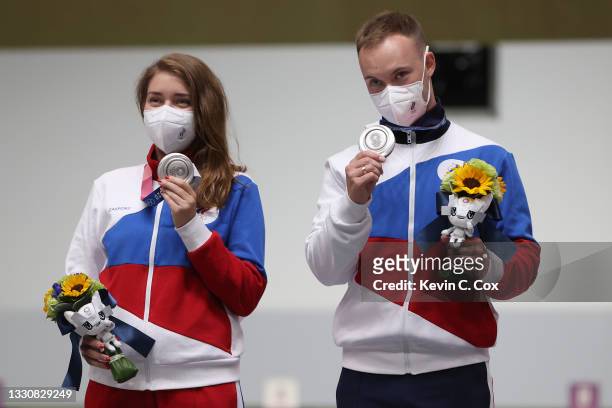 Silver Medalists Vitalina Batsarashkina and Artem Chernousov of Team ROC pose during the medal ceremony following the 10m Air Pistol Mixed Team event...