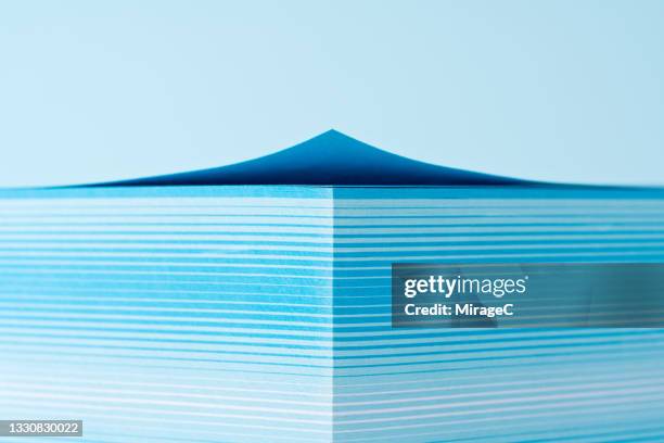 stacked blue paper with curved corner - analytics minimal stock pictures, royalty-free photos & images