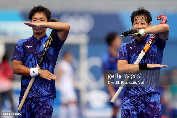 Hirotaka Zendana and Masaki Ohashi of Team Japan celebrate scoring their second goal during the Men's Preliminary Pool A match between Japan and New...