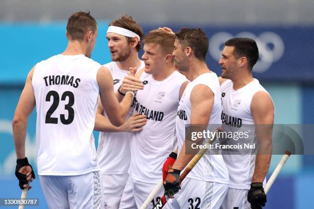 Sam Lane of Team New Zealand celebrates scoring the second goal with Blair Tarrant, Nick Wilson and Nick Ross during the Men's Preliminary Pool A...