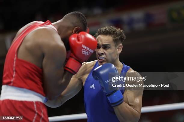 Youness Baalla of Morocco exchanges punches with David Nyika of New Zealand during the Men's Heavy on day four of the Tokyo 2020 Olympic Games at...