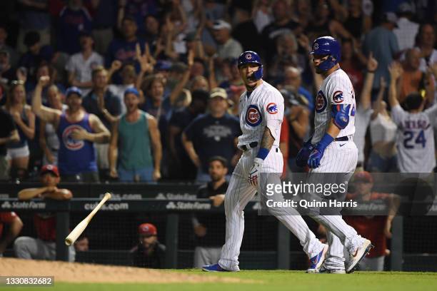Javier Baez of the Chicago Cubs reacts after his walk off single in the ninth inning against the Cincinnati Reds at Wrigley Field on July 26, 2021 in...