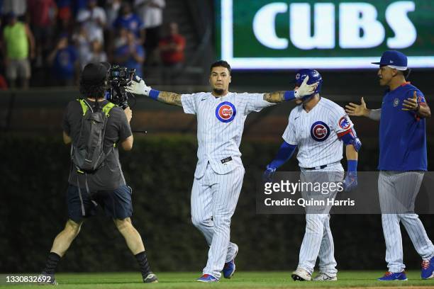 Javier Baez of the Chicago Cubs reacts after his walk off single in the ninth inning against the Cincinnati Reds at Wrigley Field on July 26, 2021 in...