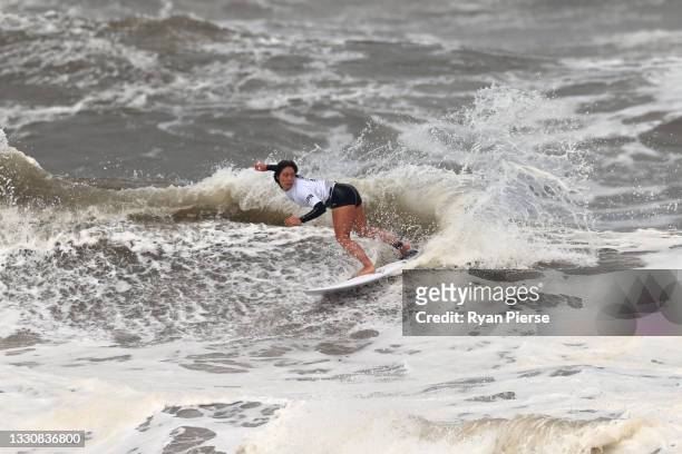 Amuro Tsuzuki of Team Japan surfs in her heat against Carissa Moore of Team United States on day four of the Tokyo 2020 Olympic Games at Tsurigasaki...