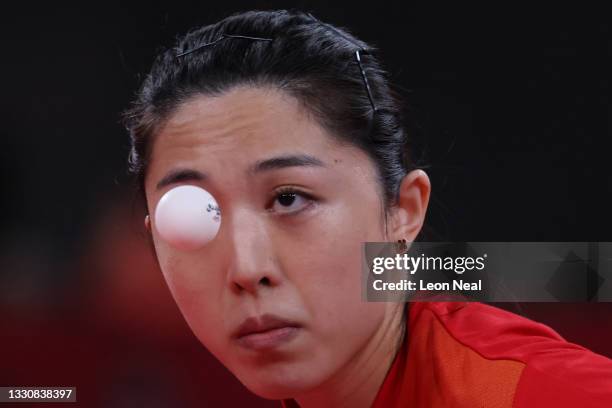 Yu Mengyu of Team Singapore serves the ball during her Women's Singles Round 3 match on day four of the Tokyo 2020 Olympic Games at Tokyo...