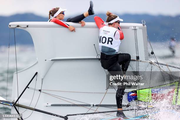 Helene Naess and Marie Roenningen of Team Norway capsize as they compete during the Women's Skiff - 49er FX class race on day four of the Tokyo 2020...