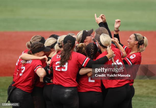 Team Canada celebrate after defeating Team Mexico 3-2 in the women's bronze medal softball game between Team Mexico and Team Canada on day four of...