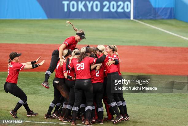 Team Canada celebrate after defeating Team Mexico 3-2 in the women's bronze medal softball game between Team Mexico and Team Canada on day four of...