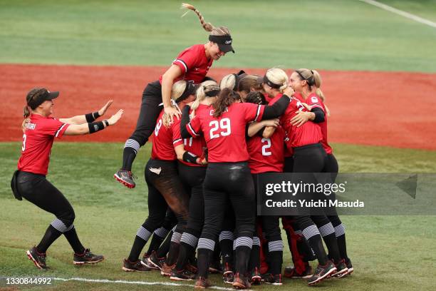 Team Canada celebrate after defeating Team Mexico 3-2 in the women's bronze medal softball game between Team Mexico and Team Canada on day four of...