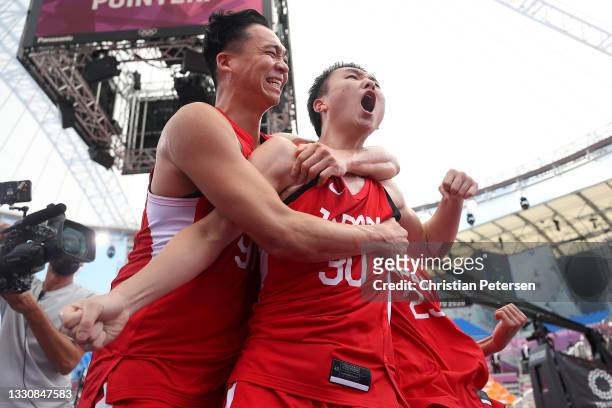 Tomoya Ochiai of Team Japan and Keisei Tominaga of Team Japan celebrate victory in the 3x3 Basketball competition on day four of the Tokyo 2020...