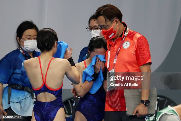 Minami Itahashi and Matsuri Arai of Team Japan react after their final dive during the Women's Synchronised 10m Platform Final on day four of the...