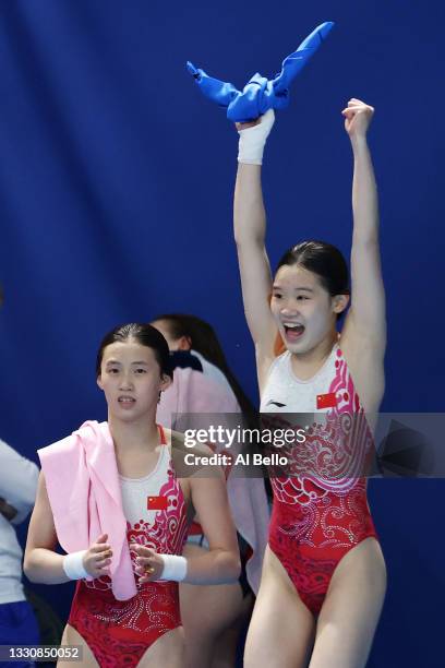 Yuxi Chen and Jiaqi Zhang of Team China celebrate winning gold after their final dive during the Women's Synchronised 10m Platform Final on day four...