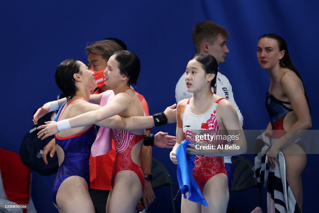 Yuxi Chen and Jiaqi Zhang of Team China celebrate winning gold after Yuxi Chen and Jiaqi Zhang of Team China celebrate winning gold after