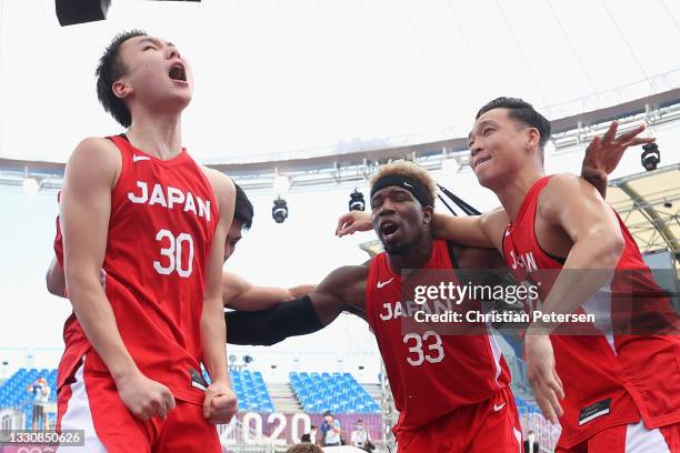 Keisei Tominaga, Ira Brown and Tomoya Ochiai of Team Japan celebrate victory in the 3x3 Basketball competition on day four of the Tokyo 2020 Olympic...