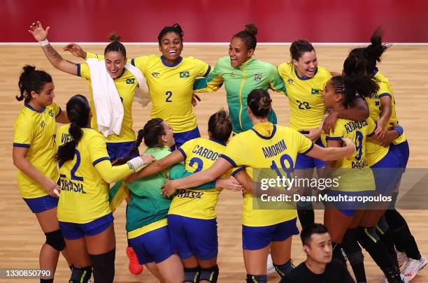 Team Brazil celebrate after winning the Woman's Preliminary Round Group B match between Brazil and Hungary on day four of the Tokyo 2020 Olympic...