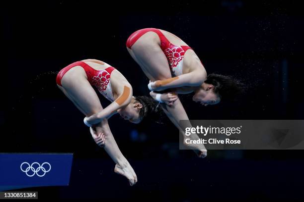 Yuxi Chen and Jiaqi Zhang of Team China compete during the Women's Synchronised 10m Platform Final on day four of the Tokyo 2020 Olympic Games at...