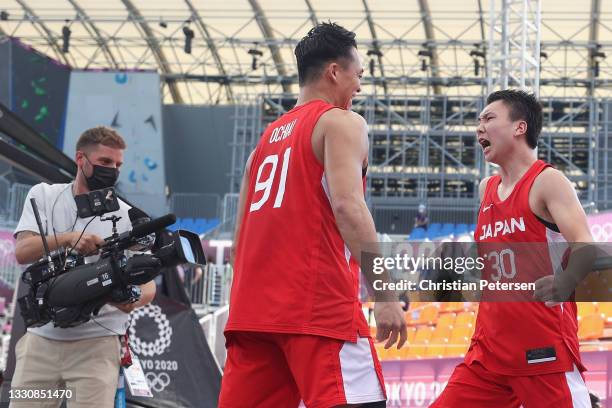 Keisei Tominaga of Team Japan and Tomoya Ochiai of Team Japan celebrate victory in the 3x3 Basketball competition on day four of the Tokyo 2020...