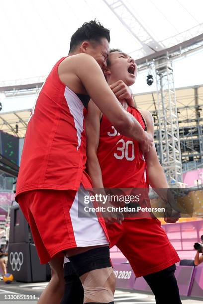 Tomoya Ochiai of Team Japan and Keisei Tominaga of Team Japan celebrate victory in the 3x3 Basketball competition on day four of the Tokyo 2020...