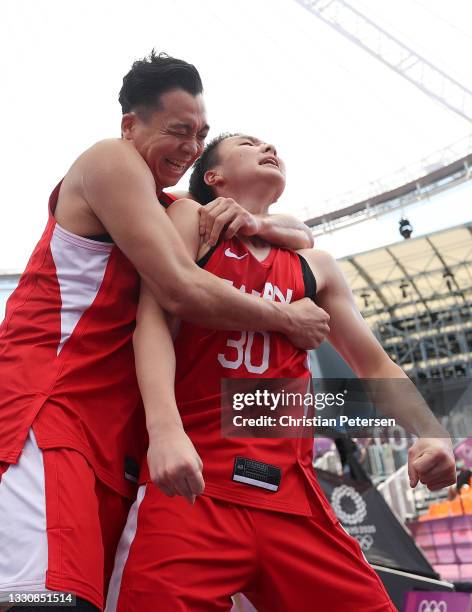 Tomoya Ochiai of Team Japan and Keisei Tominaga of Team Japan celebrate victory in the 3x3 Basketball competition on day four of the Tokyo 2020...