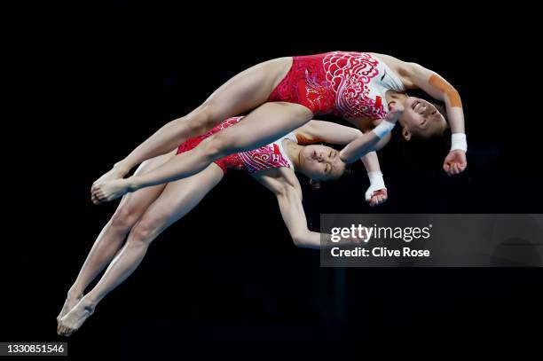 Yuxi Chen and Jiaqi Zhang of Team China compete during the Women's Synchronised 10m Platform Final on day four of the Tokyo 2020 Olympic Games at...