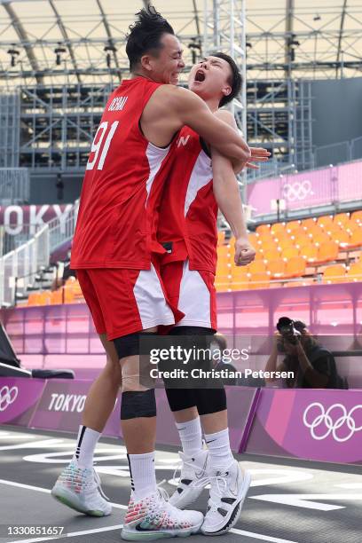 Tomoya Ochiai of Team Japan and Keisei Tominaga of Team Japan celebrate victory in the 3x3 Basketball competition on day four of the Tokyo 2020...