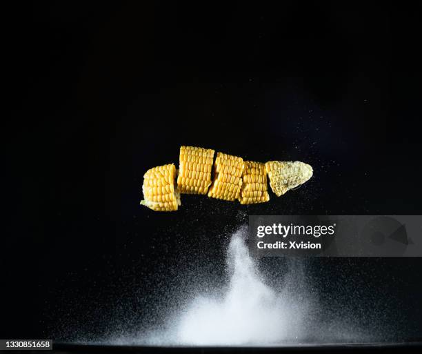 corn cob cutted flying in mid air with high speed sync. - corn cob photos et images de collection